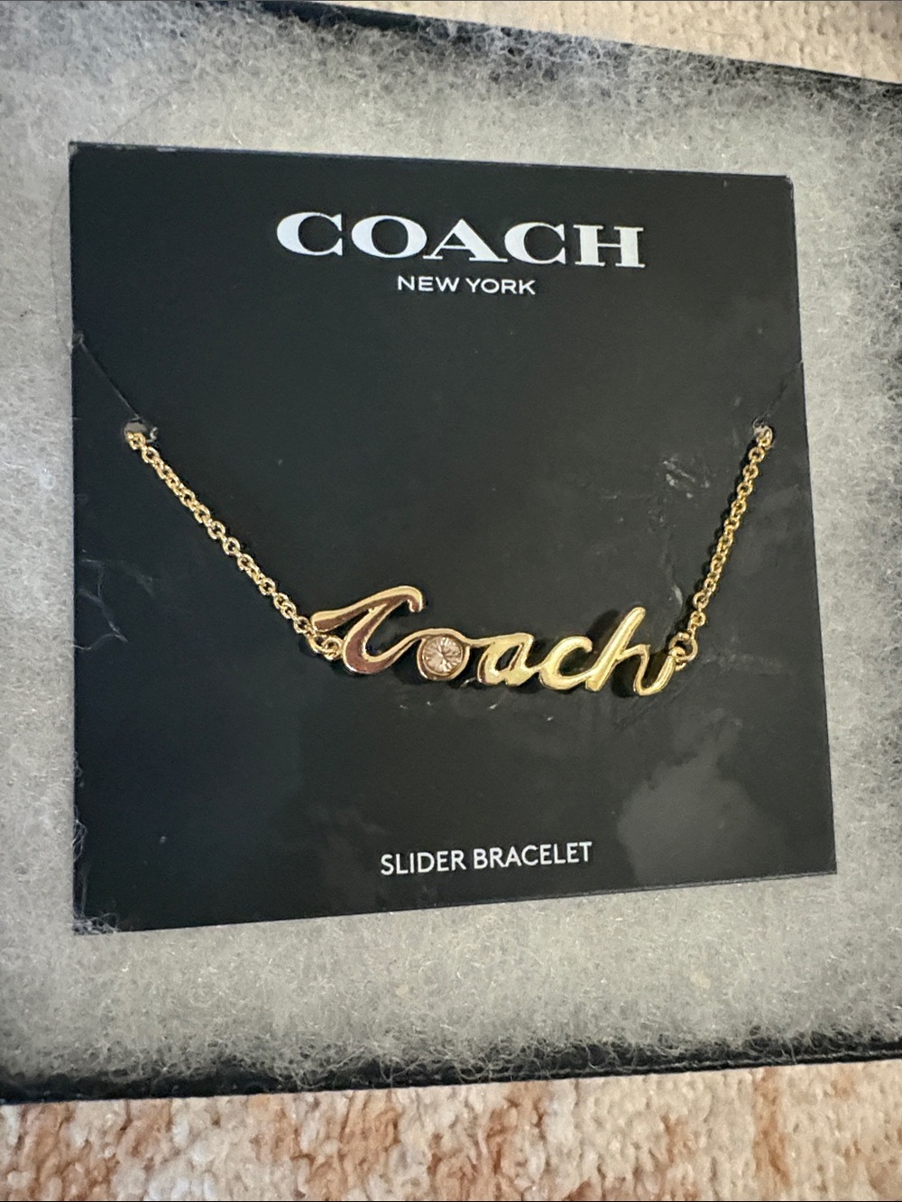 Coach Gold Script Logo Slider Bracelet - Gold Tone